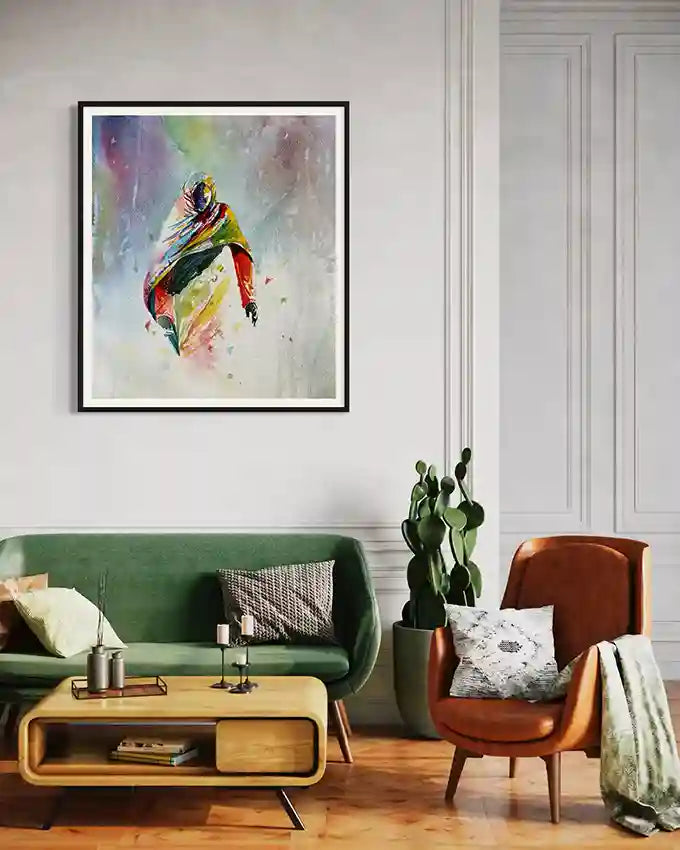 Living room with a green sofa, brown armchair, and colorful abstract Sudanese woman on the wall, print by visual Sudanese artist Galal Yousif, in UAE