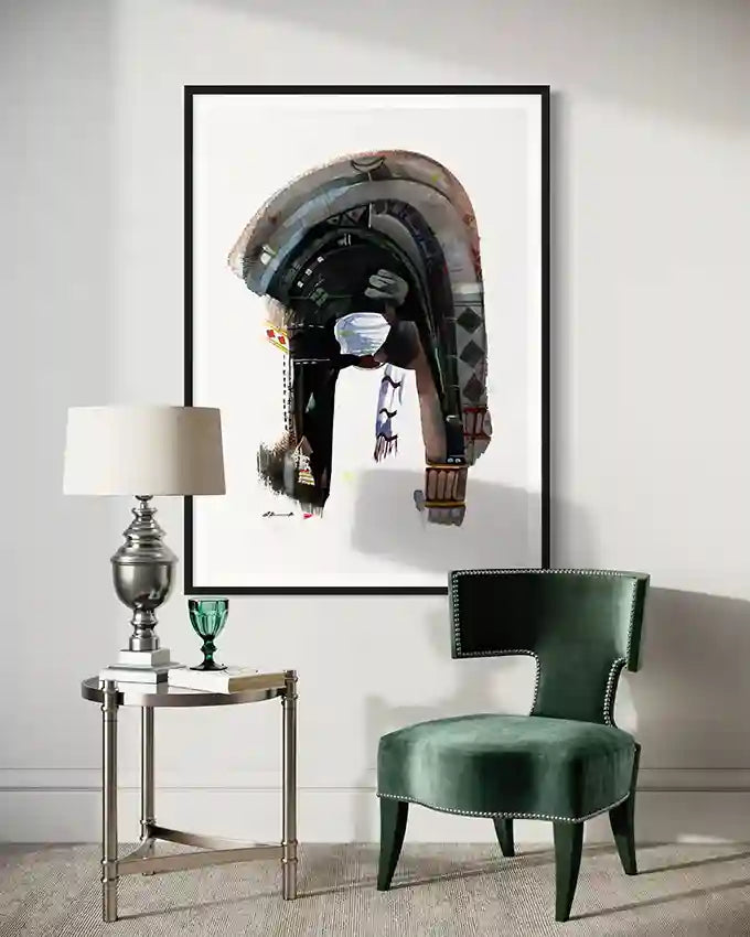 Modern interior with a green chair, side table, and framed art print on the wall by artist Galal Yousif, in UAE and abroad