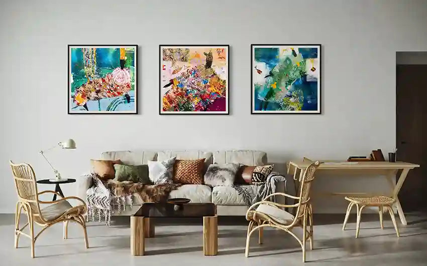 Three framed Hani Khalil Sufi prints (Sufi 8 & 9) above neutral sofa with rattan furniture in boho-chic living room