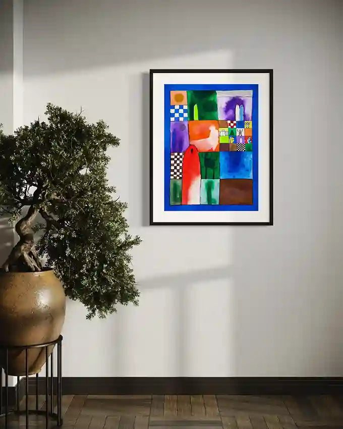 "Memory Quilt" art print by Abushariaa Ahmed framed on wall next to large potted plant in modern interior setting